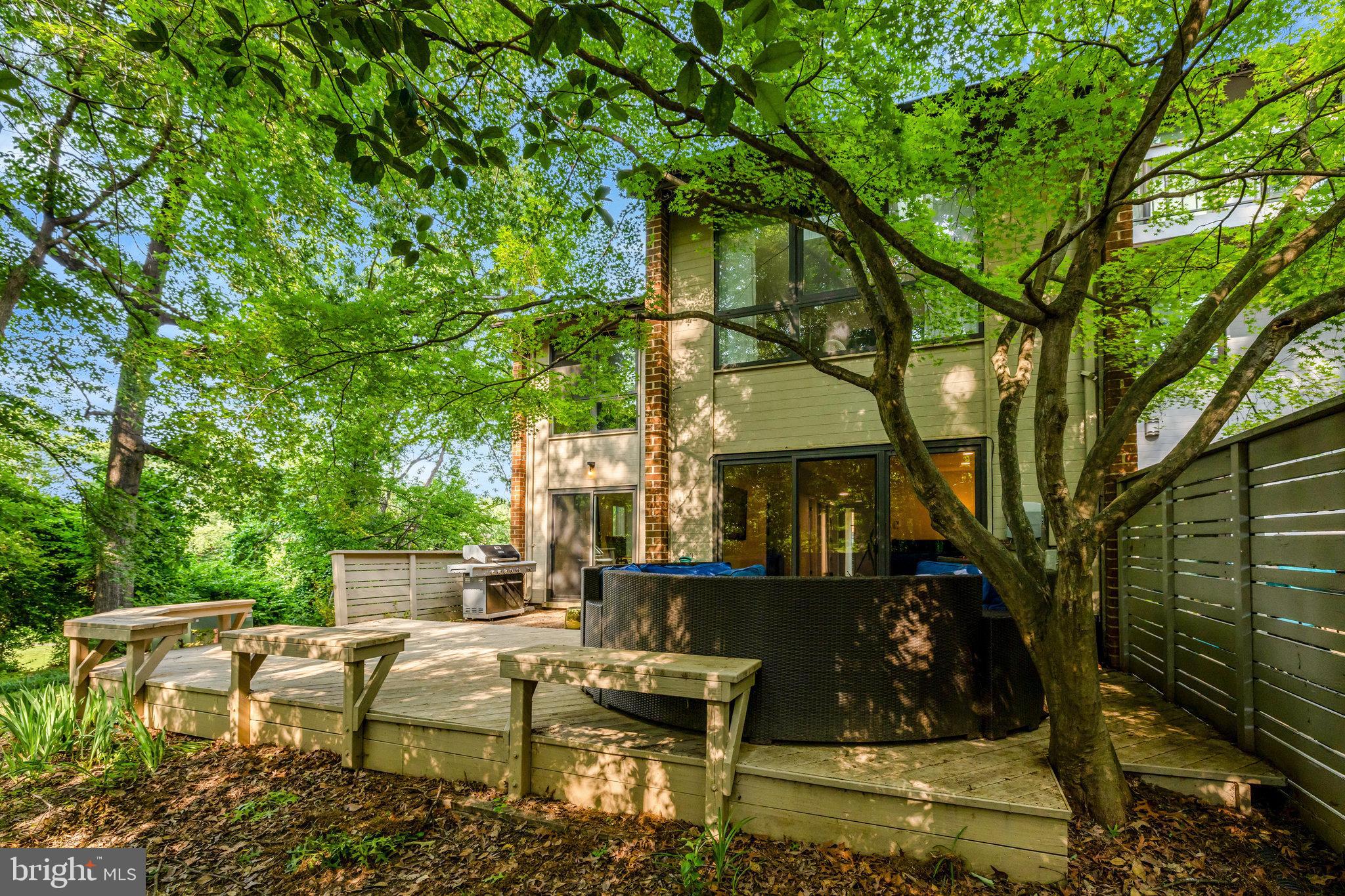 11712 Indian Ridge Road Reston, VA 20191 - Photo 46 of 77 a view of house with backyard outdoor seating and trees