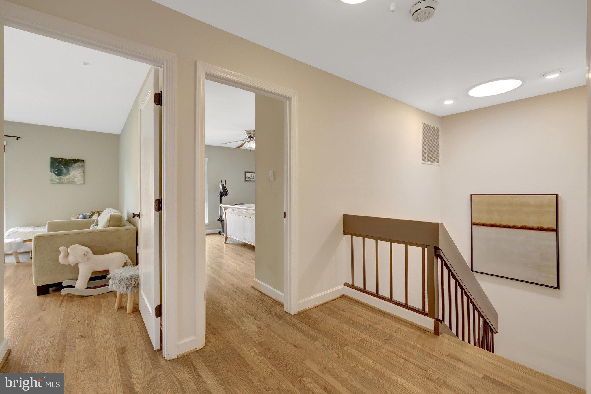 11712 Indian Ridge Road Reston, VA 20191 - Photo 57 of 77 a view of a hallway with a livingroom and a bathroom