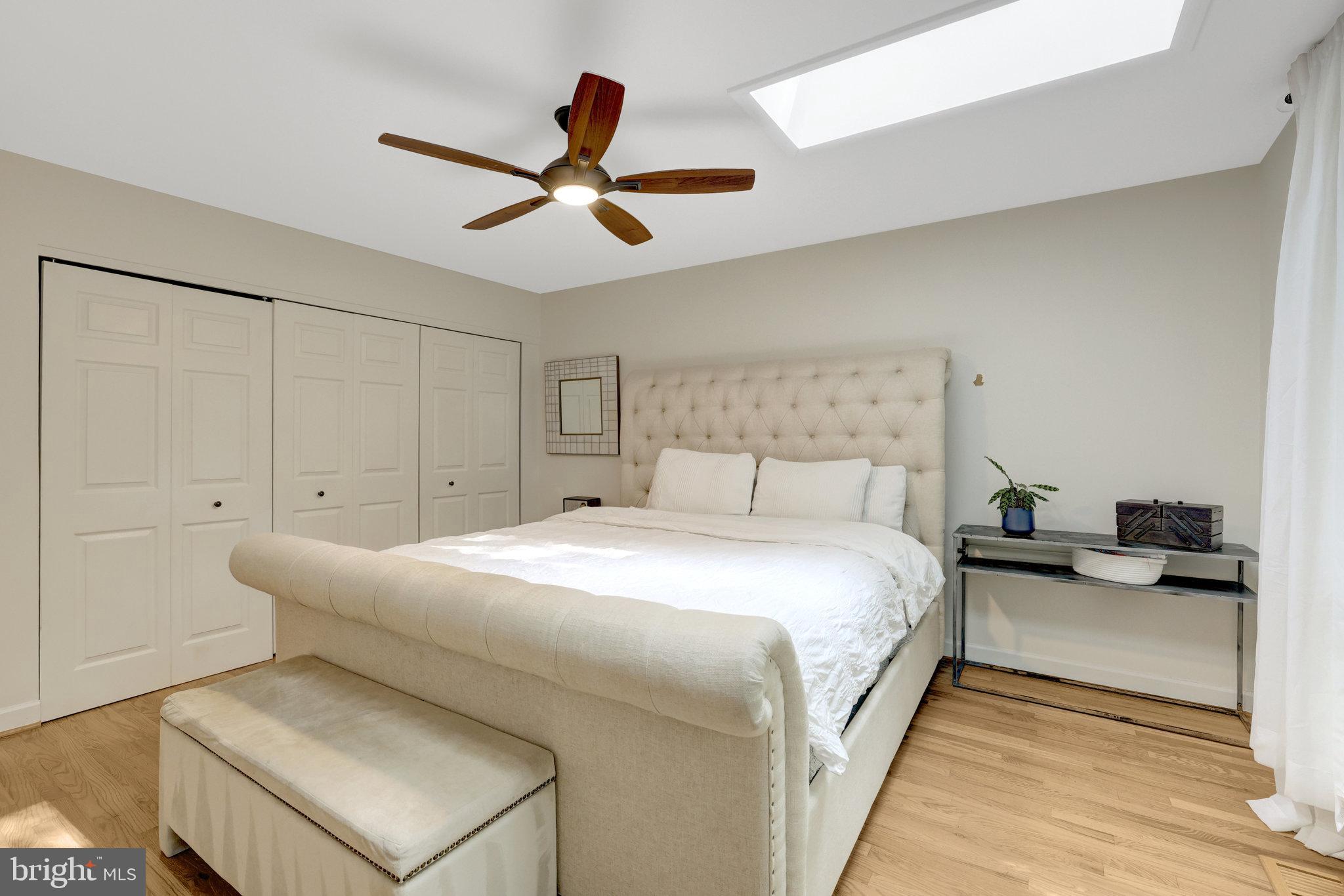 11712 Indian Ridge Road Reston, VA 20191 - Photo 60 of 77 a bedroom with a bed and a ceiling fan