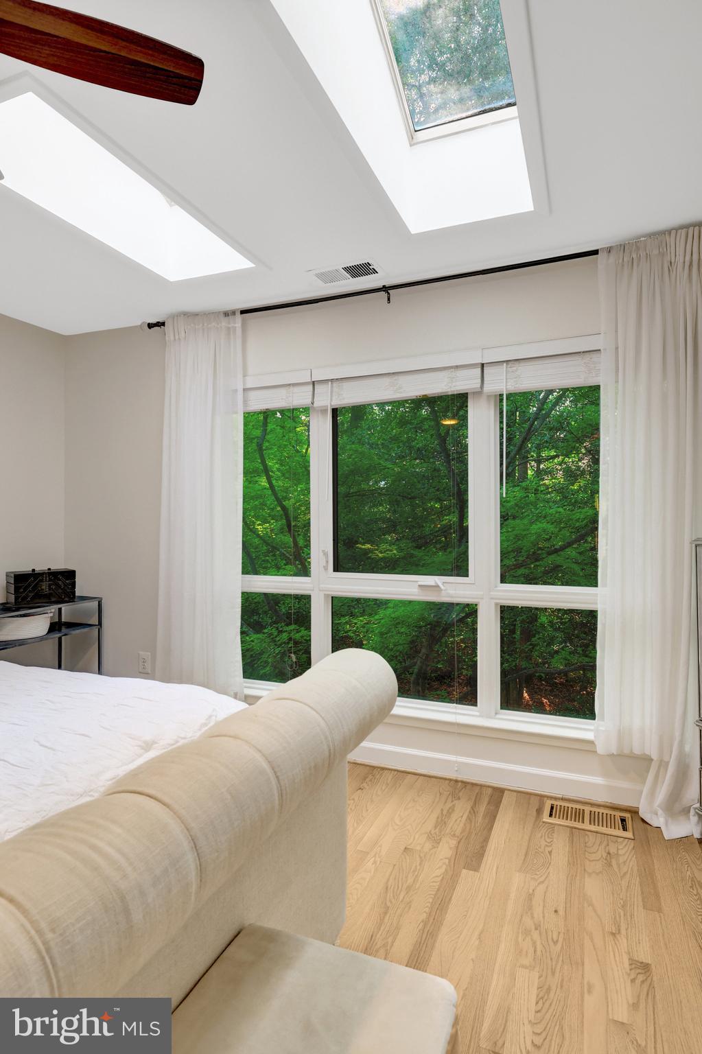 11712 Indian Ridge Road Reston, VA 20191 - Photo 62 of 77 a bed sitting in a bedroom next to a window
