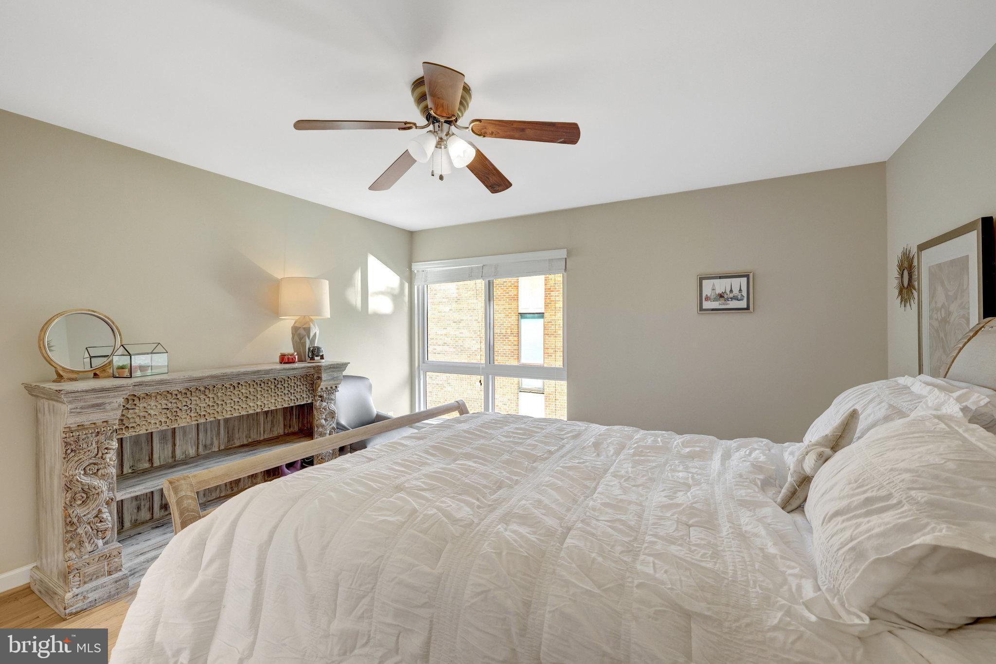 11712 Indian Ridge Road Reston, VA 20191 - Photo 66 of 77 a bedroom with a bed and ceiling fan