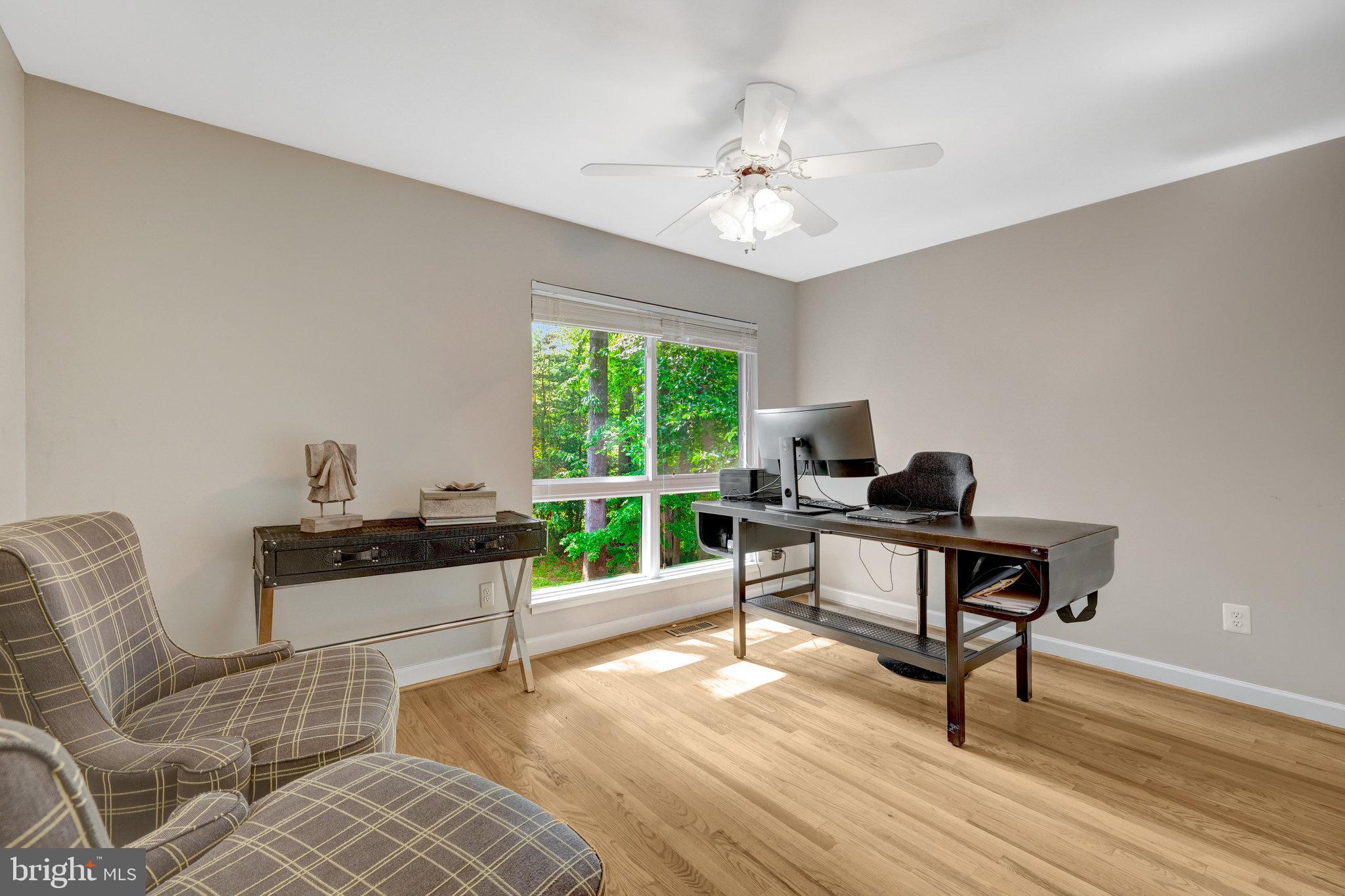 11712 Indian Ridge Road Reston, VA 20191 - Photo 68 of 77 a view of a livingroom with workspace and a window