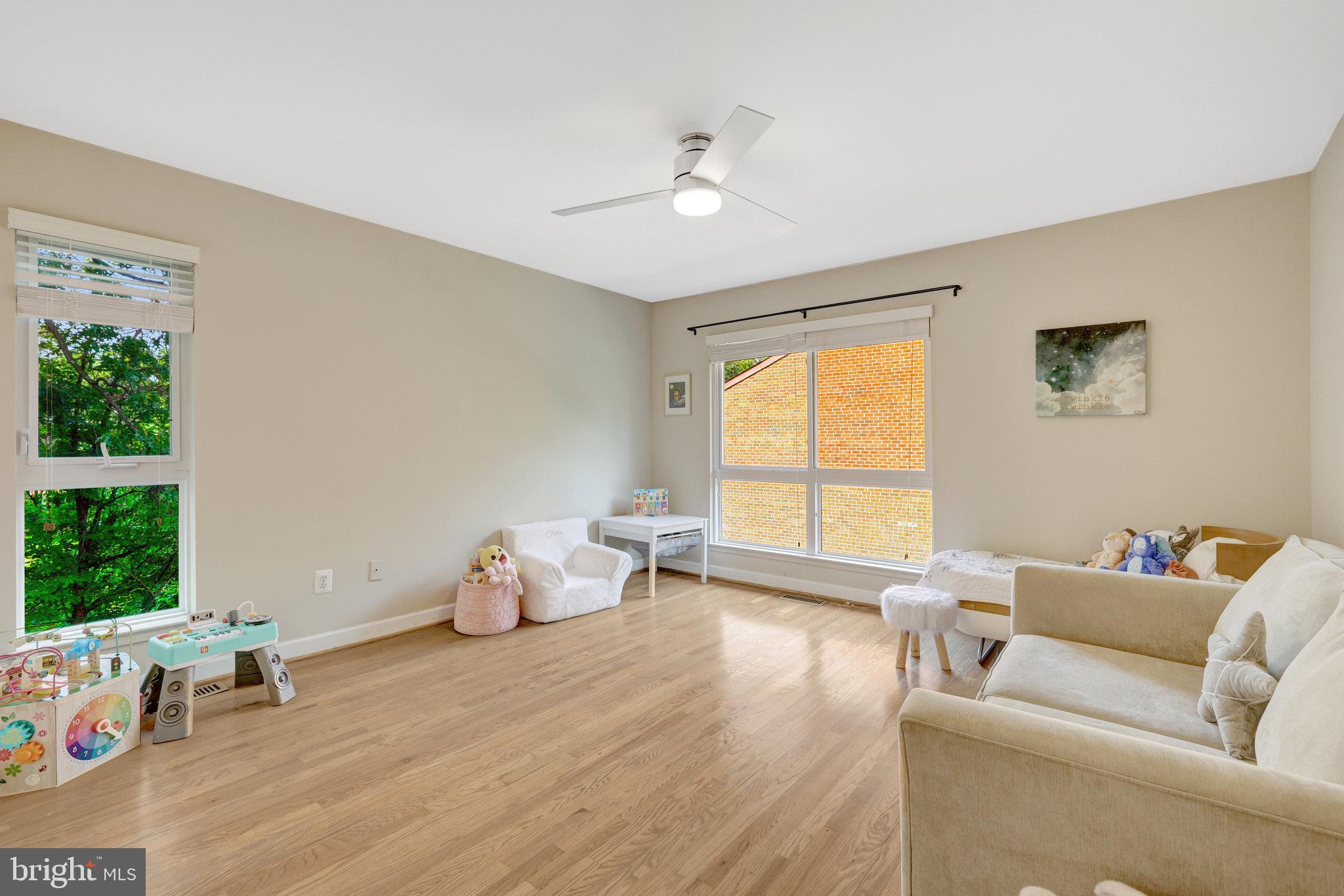 11712 Indian Ridge Road Reston, VA 20191 - Photo 70 of 77 a living room with furniture and a large window