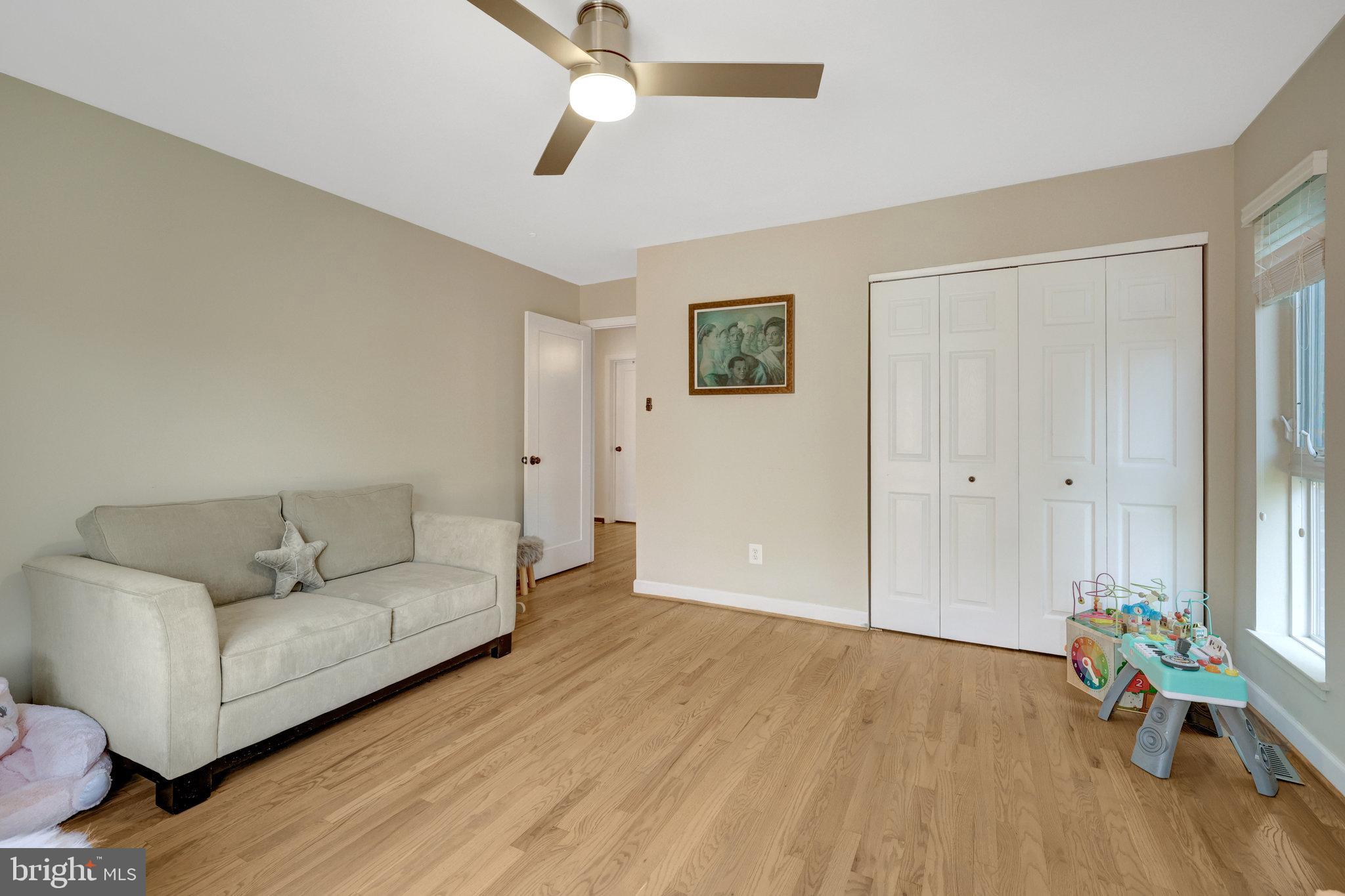 11712 Indian Ridge Road Reston, VA 20191 - Photo 71 of 77 a living room with furniture and a wooden floor