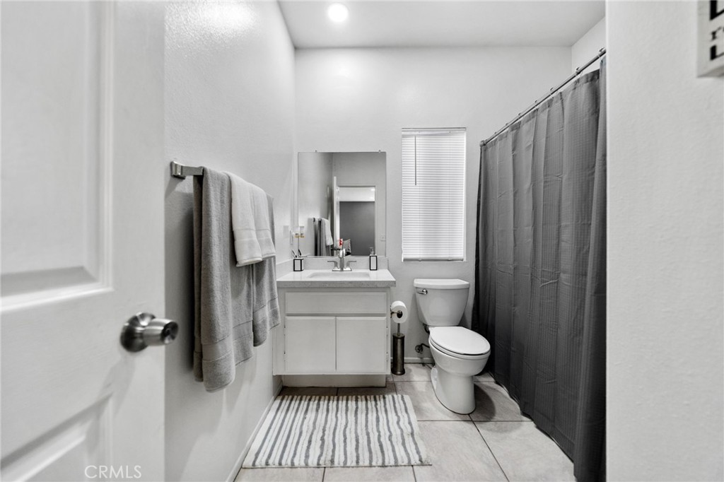 1494 Rabbit Peak Way Hemet, CA 92545 - Photo 11 of 45 a bathroom with a sink toilet and shower