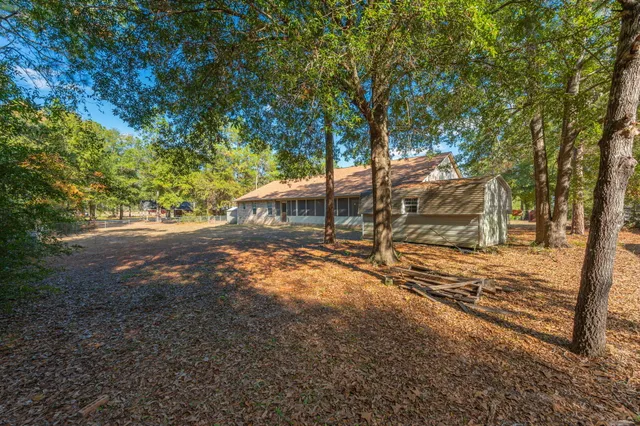 a backyard of a house with lots of green space