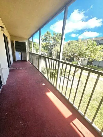 a view of hallway with furniture