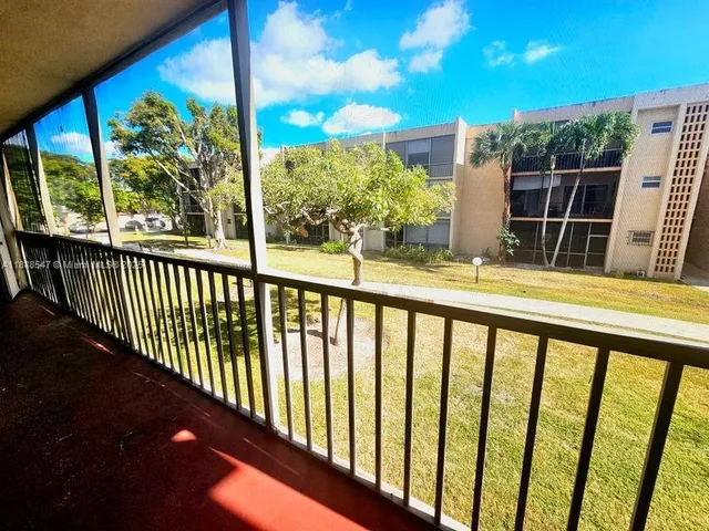 a view of balcony with furniture