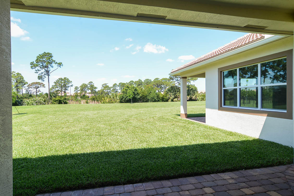 7414 Southeast Ravissant Drive Stuart, FL 34997 - Photo 15 of 25 a view of an house with backyard space and balcony