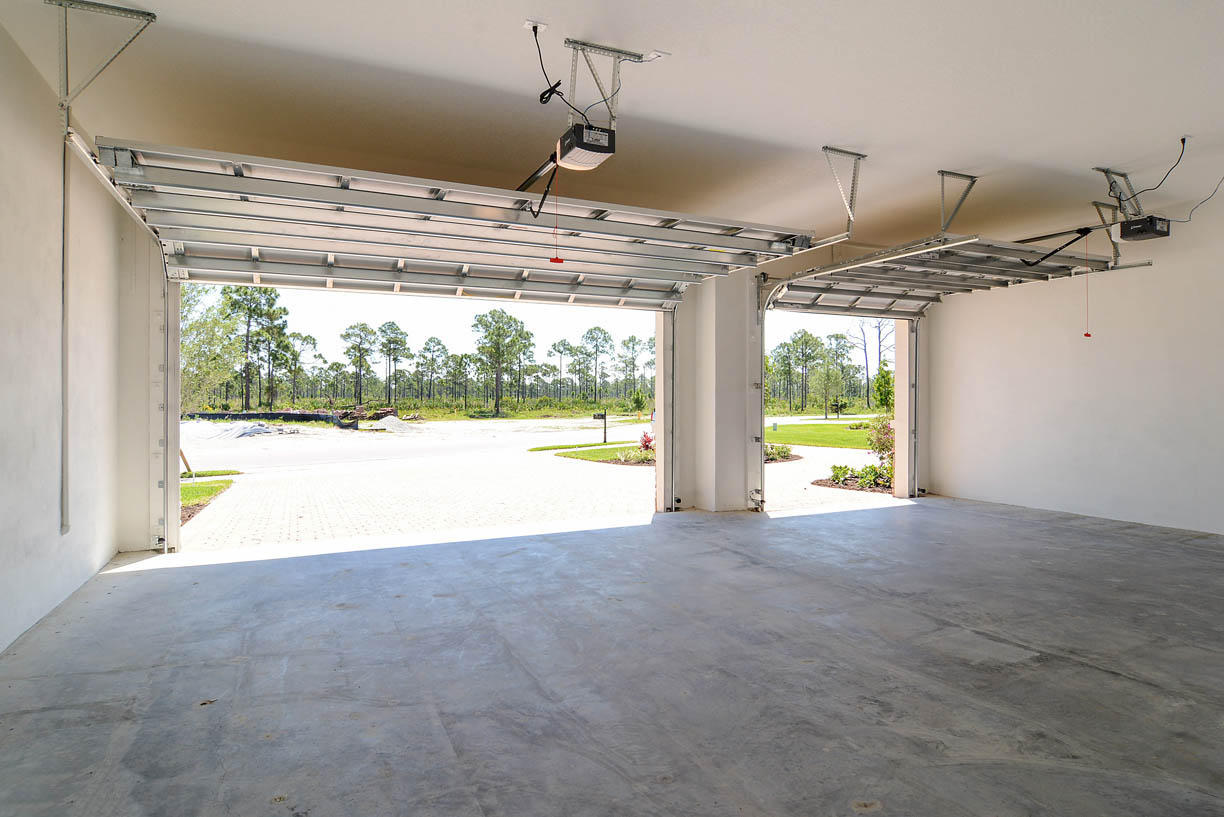 7414 Southeast Ravissant Drive Stuart, FL 34997 - Photo 17 of 25 a view of a room with wooden floor and windows