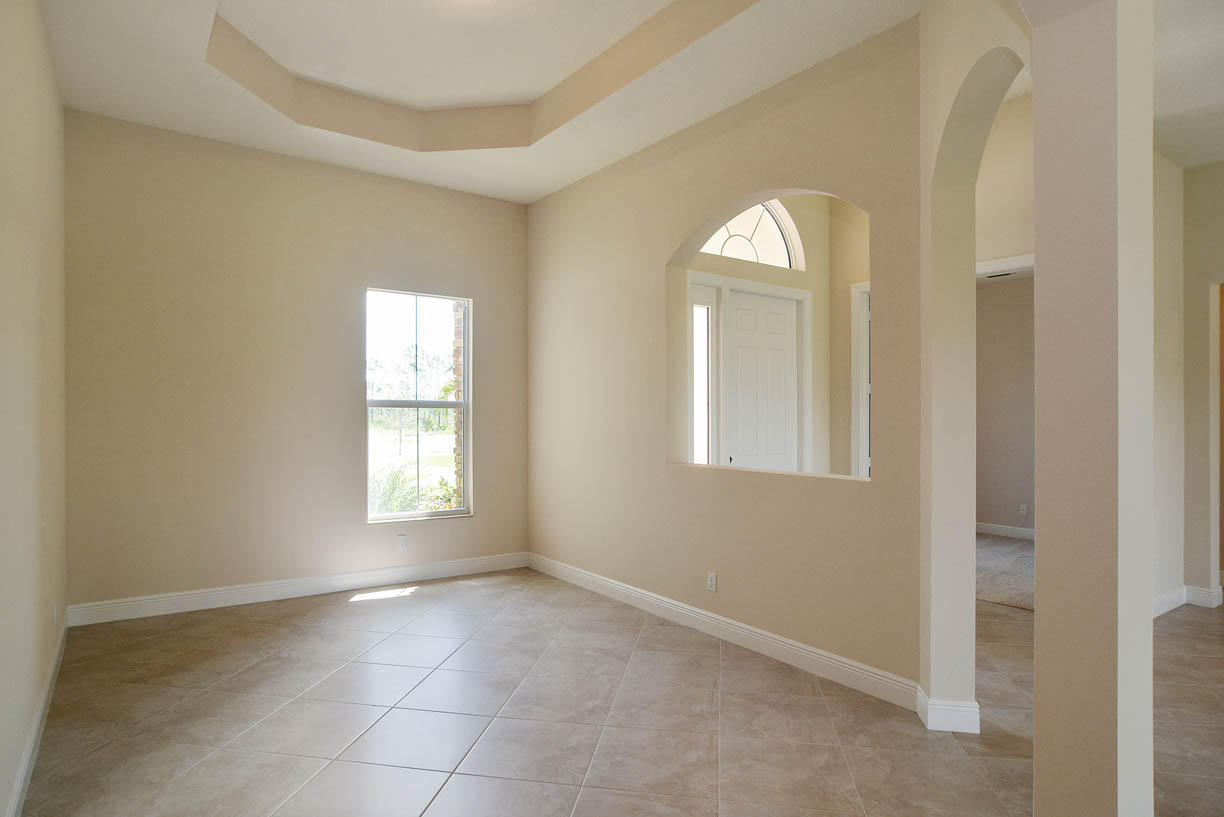 7414 Southeast Ravissant Drive Stuart, FL 34997 - Photo 3 of 25 a view of a livingroom with windows