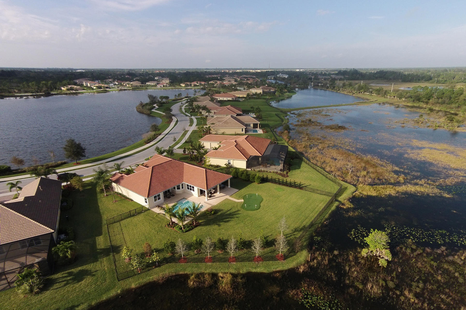7414 Southeast Ravissant Drive Stuart, FL 34997 - Photo 21 of 25 an aerial view of residential houses with outdoor space