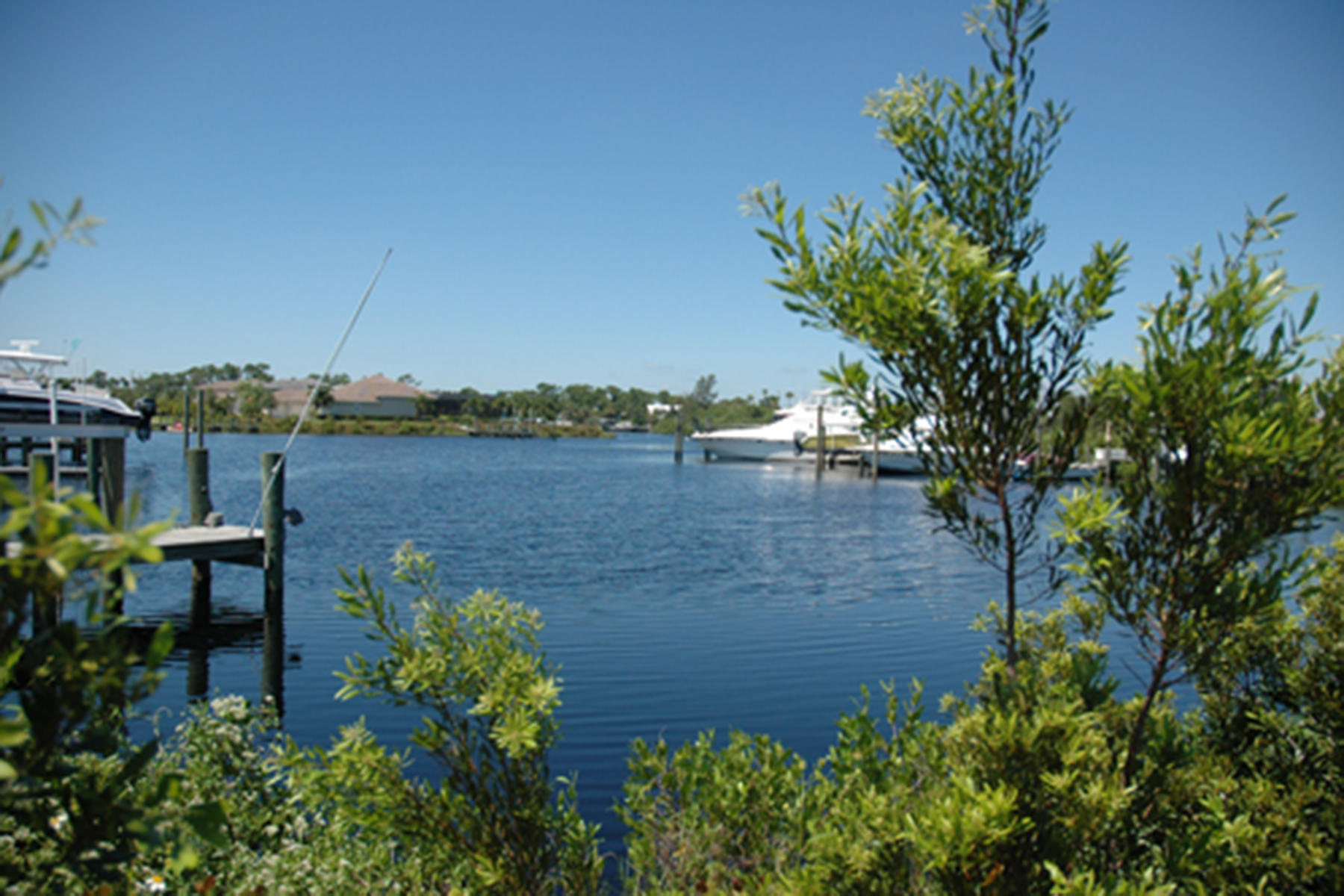 7414 Southeast Ravissant Drive Stuart, FL 34997 - Photo 24 of 25 a view of a lake with sitting area
