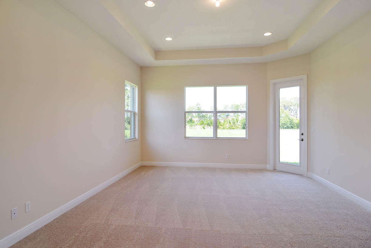 7414 Southeast Ravissant Drive Stuart, FL 34997 - Photo 6 of 25 an empty room with windows