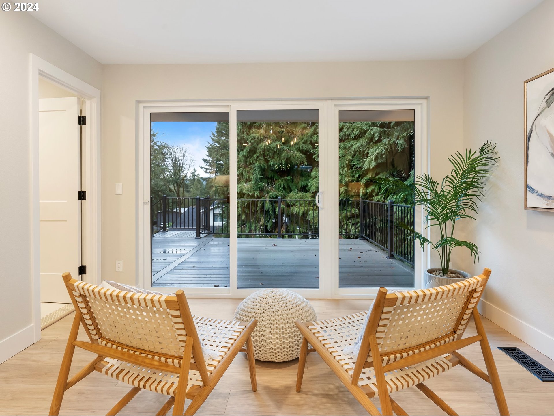 2711 Greentree Road Lake Oswego, OR 97034 - Photo 18 of 42 a view of a dining room with furniture and wooden floor