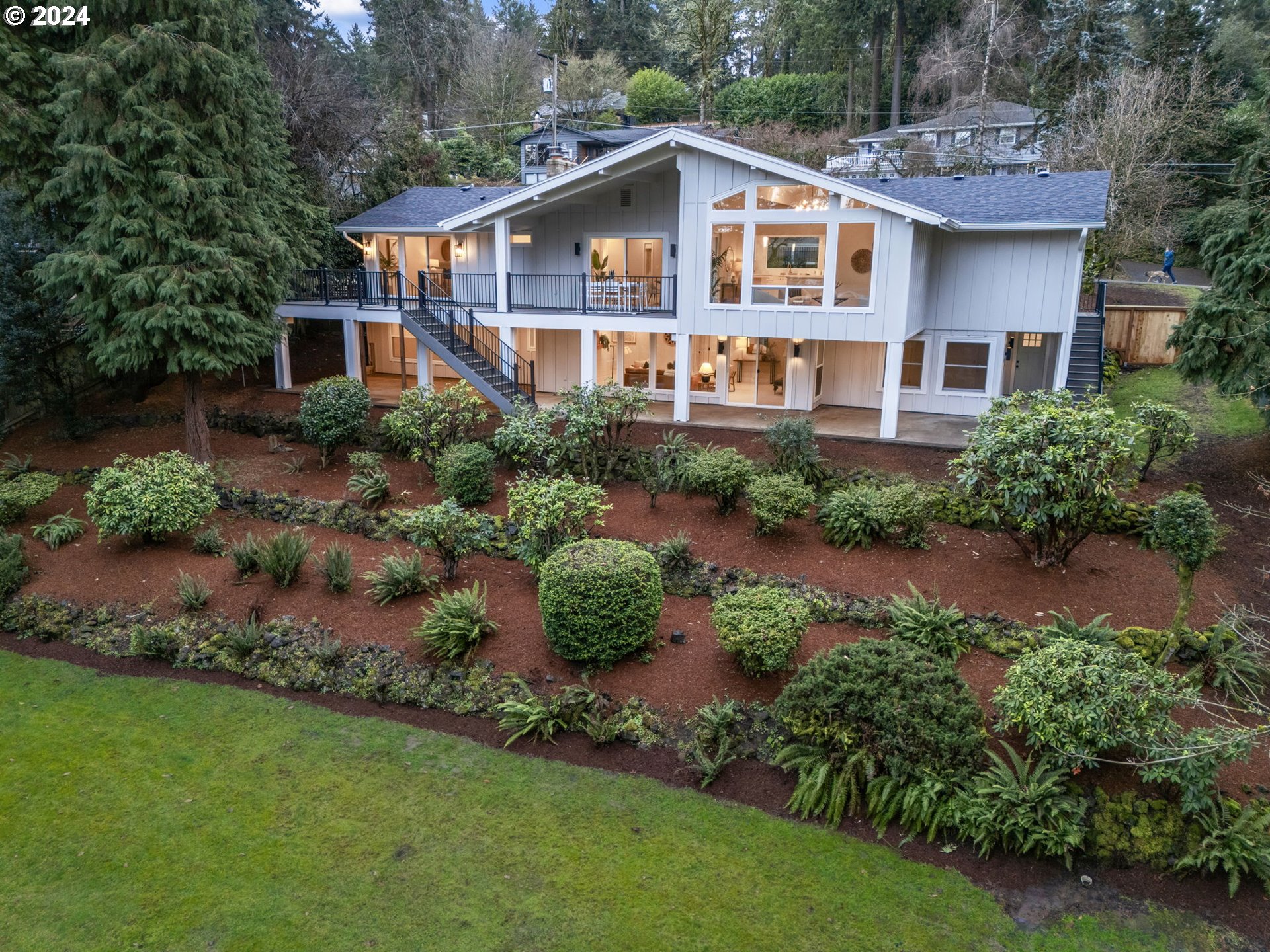 2711 Greentree Road Lake Oswego, OR 97034 - Photo 2 of 42 a front view of a house with a yard and potted plants