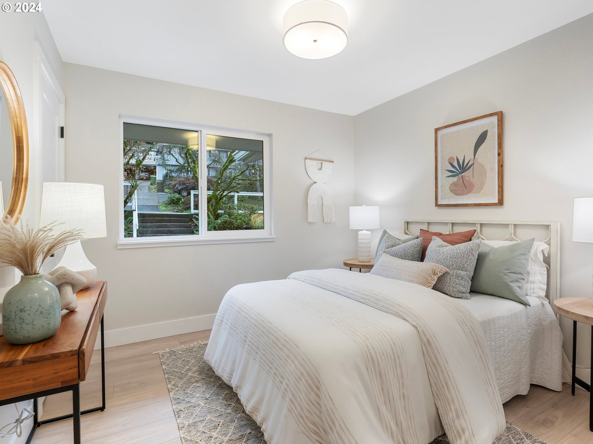 2711 Greentree Road Lake Oswego, OR 97034 - Photo 27 of 42 a bedroom with a bed and windows