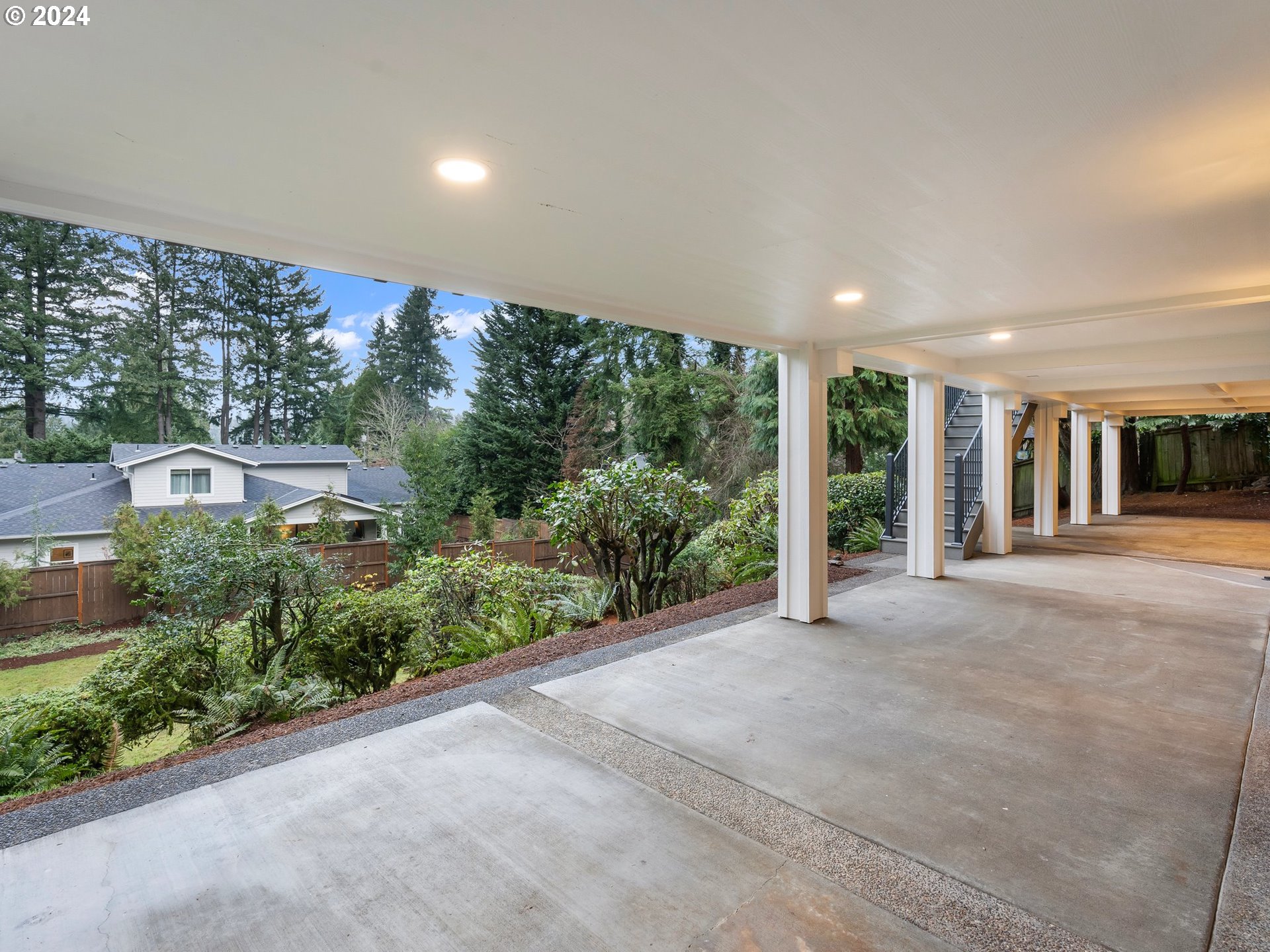 2711 Greentree Road Lake Oswego, OR 97034 - Photo 35 of 42 a view of a big room with glass windows and brick walls
