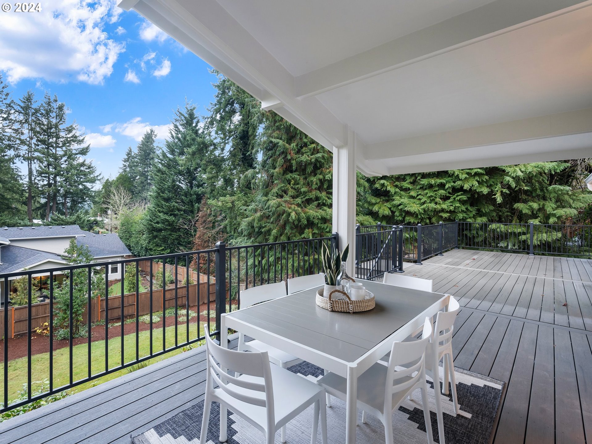 2711 Greentree Road Lake Oswego, OR 97034 - Photo 37 of 42 a view of a patio with a table chairs and wooden floor