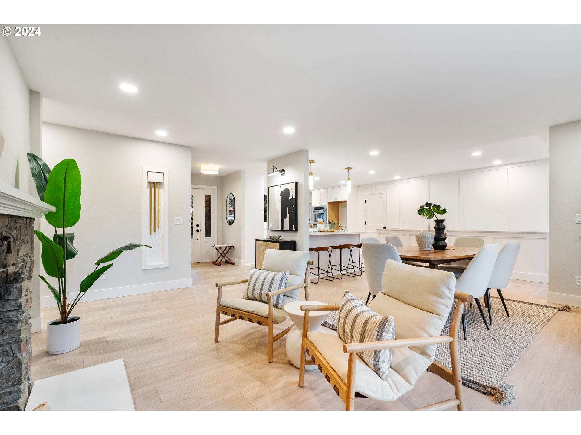 2711 Greentree Road Lake Oswego, OR 97034 - Photo 6 of 42 a living room with furniture a wooden floor and a chandelier