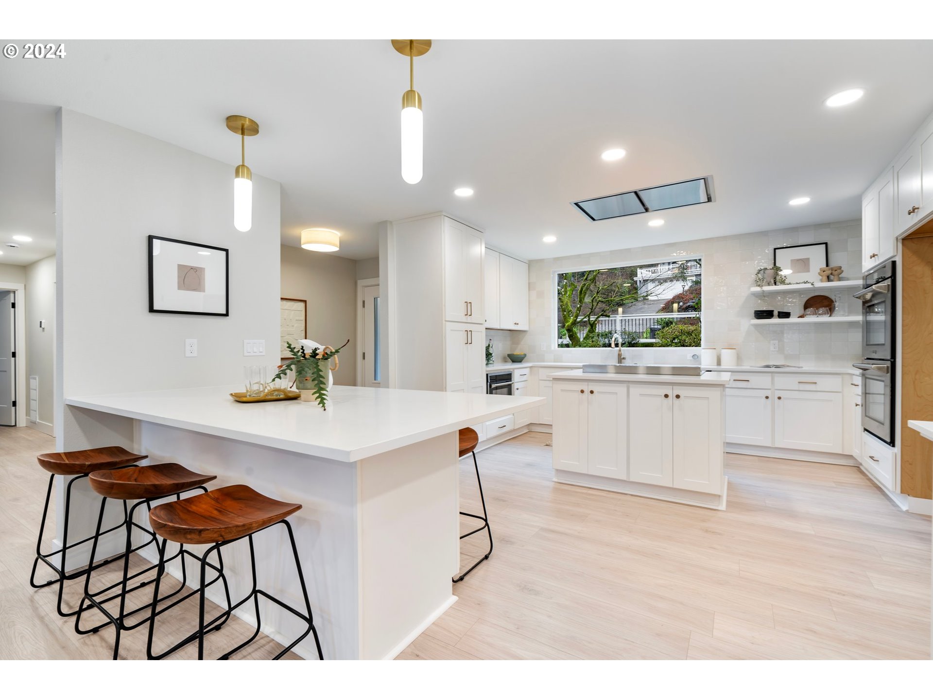 2711 Greentree Road Lake Oswego, OR 97034 - Photo 7 of 42 a kitchen with cabinets and chairs