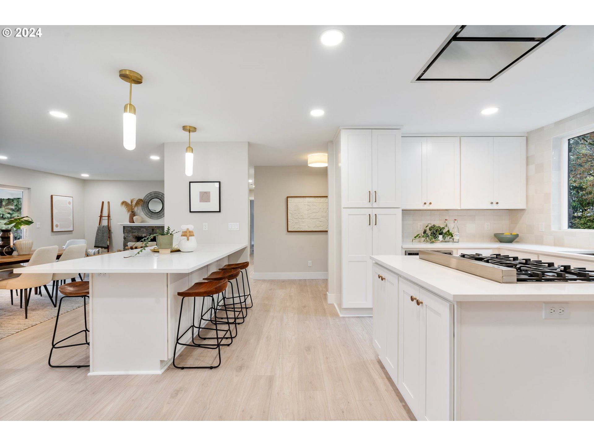 2711 Greentree Road Lake Oswego, OR 97034 - Photo 9 of 42 a kitchen with stainless steel appliances a sink a stove a refrigerator cabinets and living room view