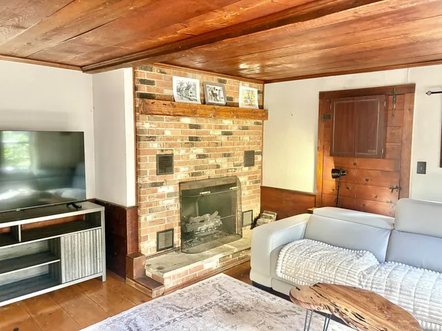 a bedroom with a bed and a fireplace