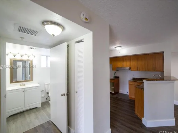 a view of a kitchen with electric appliances