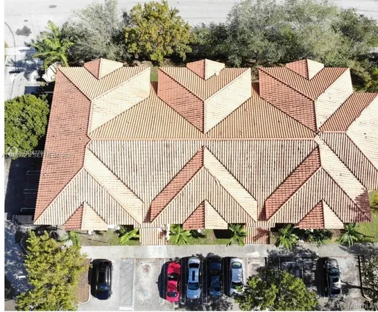 a view of street along with house and trees