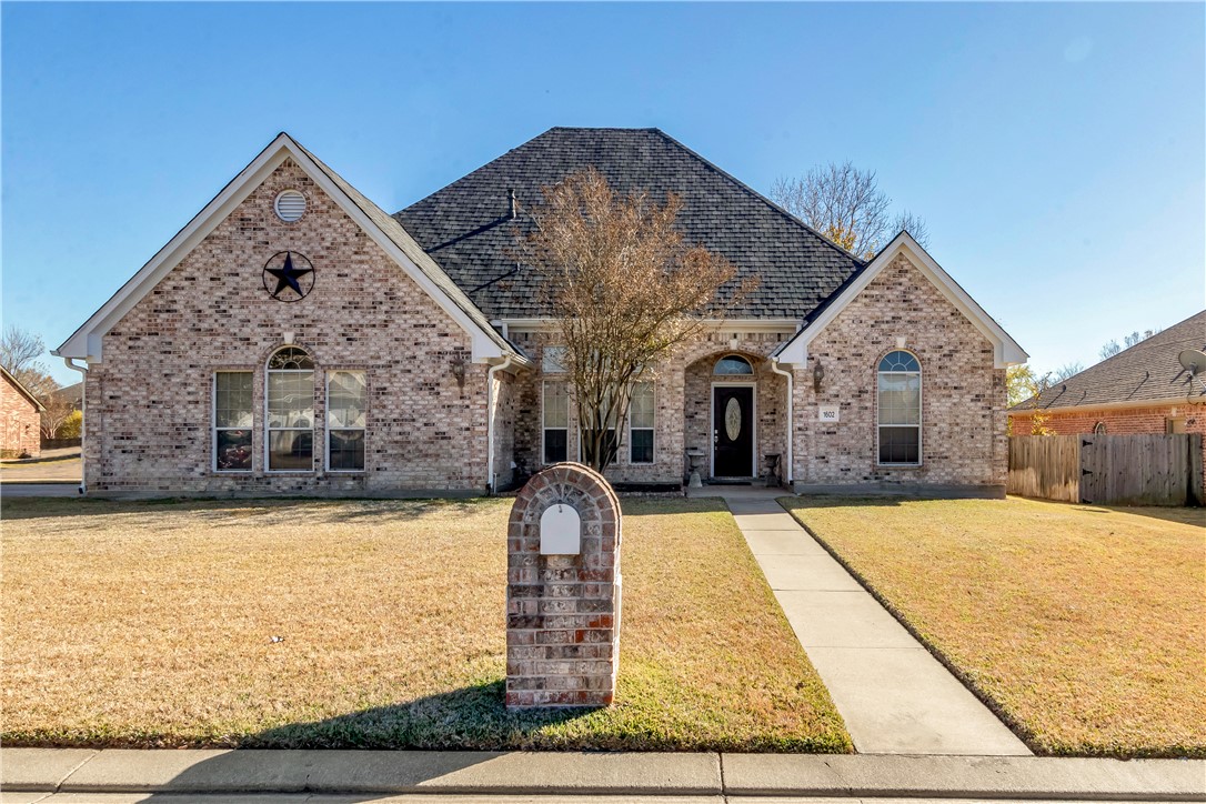 1602 Leopard Court College Station, TX 77840 - Photo 1 of 28 a front view of house with yard