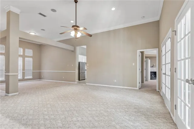 a view of an empty room with a window