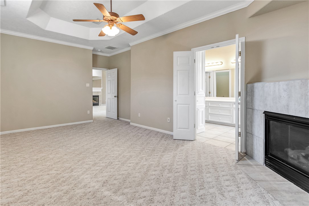 1602 Leopard Court College Station, TX 77840 - Photo 17 of 28 a view of empty room with fireplace and fan