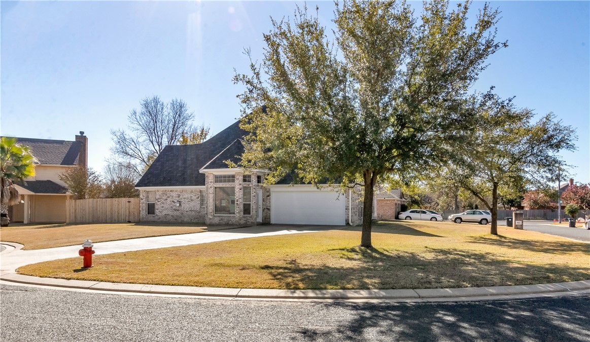 1602 Leopard Court College Station, TX 77840 - Photo 2 of 28 a swimming pool with outdoor seating and yard