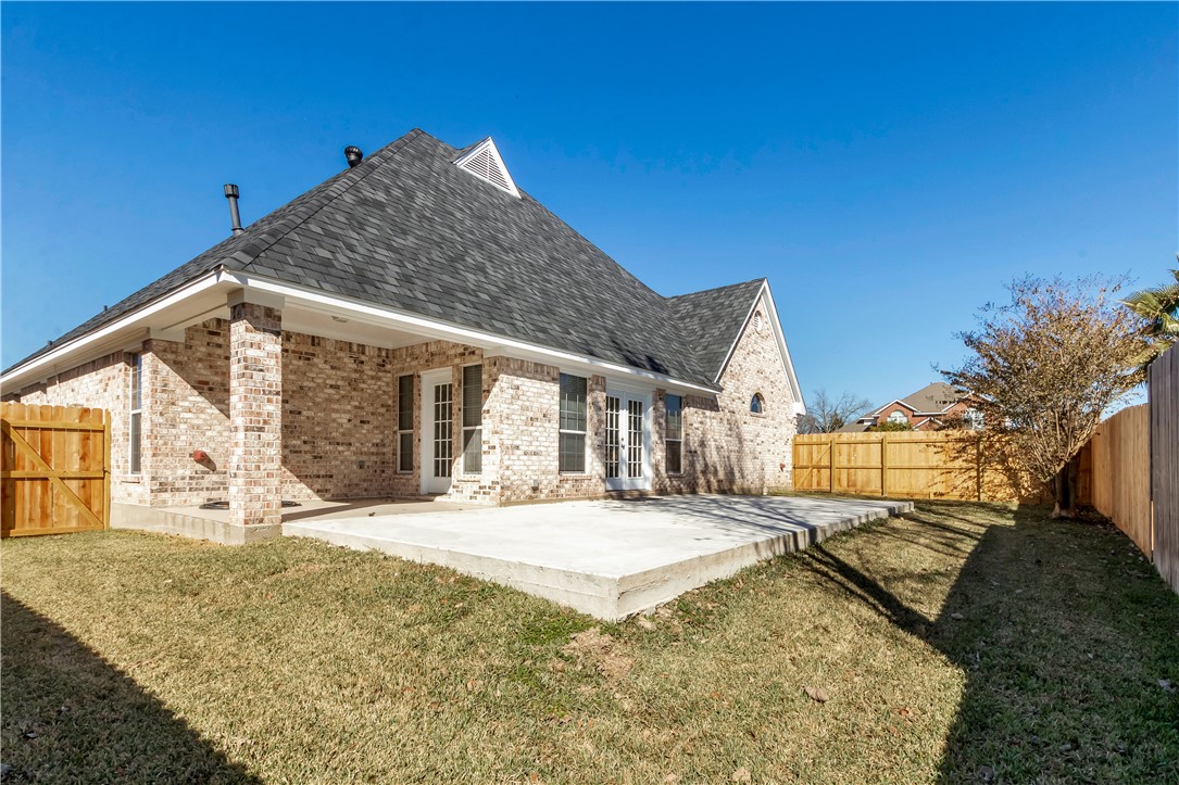 1602 Leopard Court College Station, TX 77840 - Photo 28 of 28 a view of house with yard and covered with snow in the background