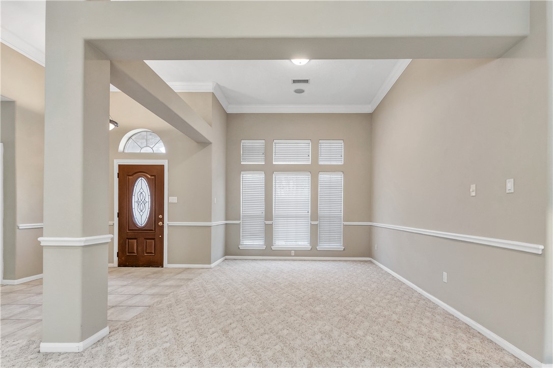 1602 Leopard Court College Station, TX 77840 - Photo 10 of 28 an empty room with mirror and a window