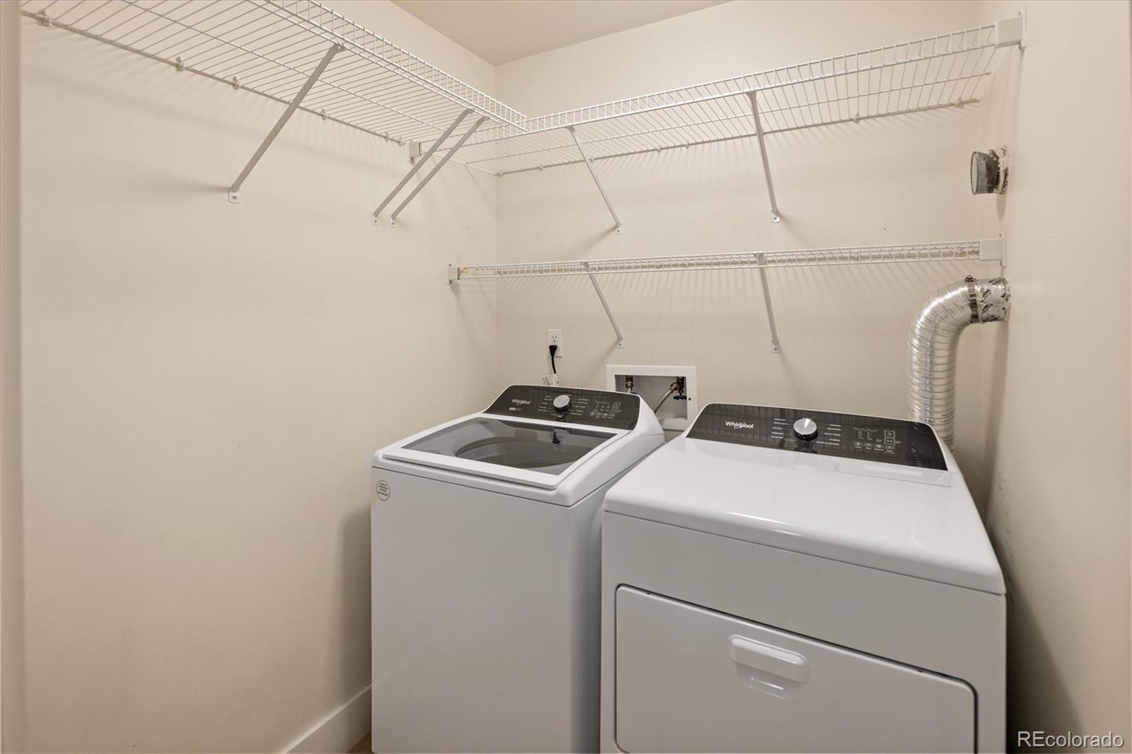 2210 Blake Street, Unit 209 Denver, CO 80205 - Photo 30 of 33 a utility room with dryer and washer