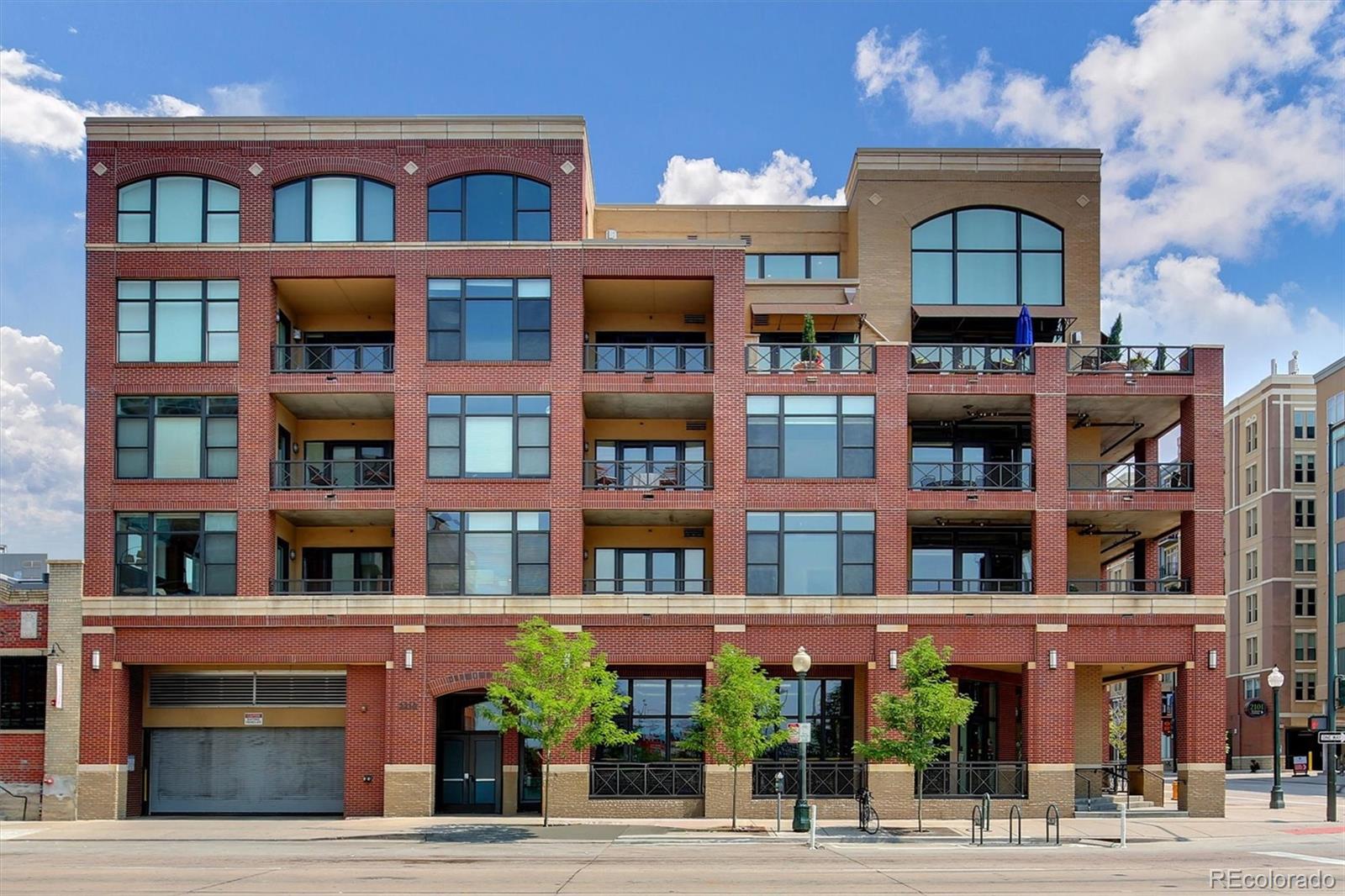 2210 Blake Street, Unit 209 Denver, CO 80205 - Photo 32 of 33 a front view of residential houses with street