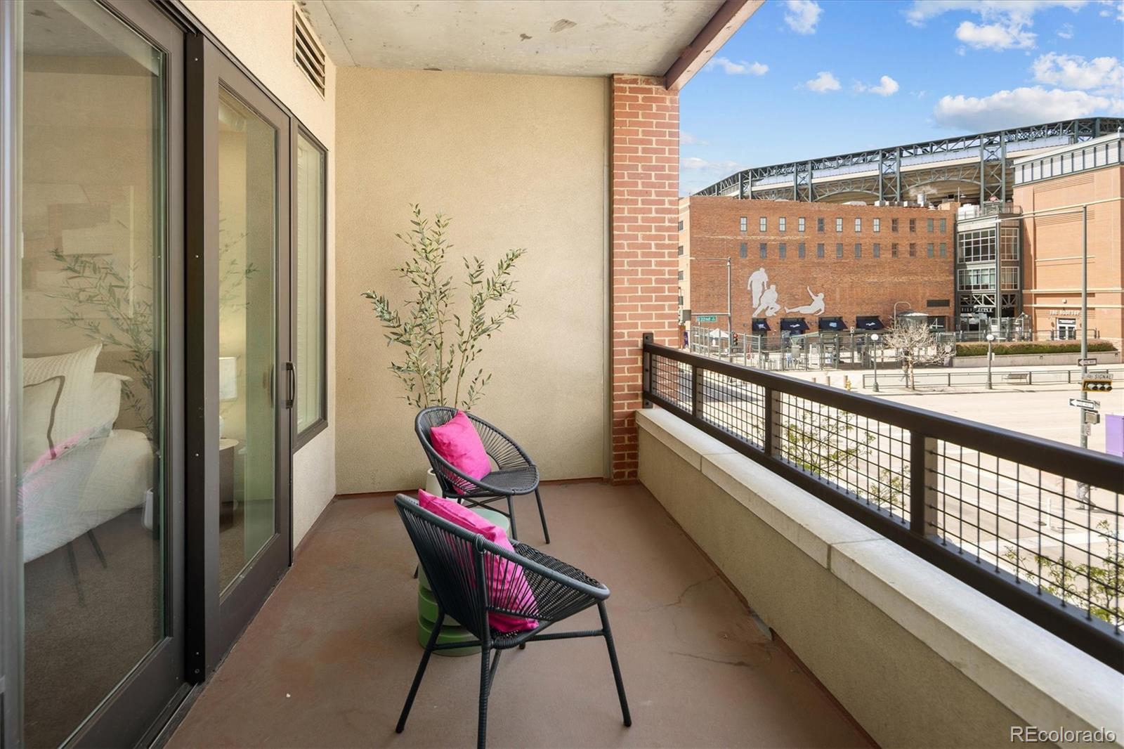 2210 Blake Street, Unit 209 Denver, CO 80205 - Photo 6 of 33 a view of a city from a hallway with furniture