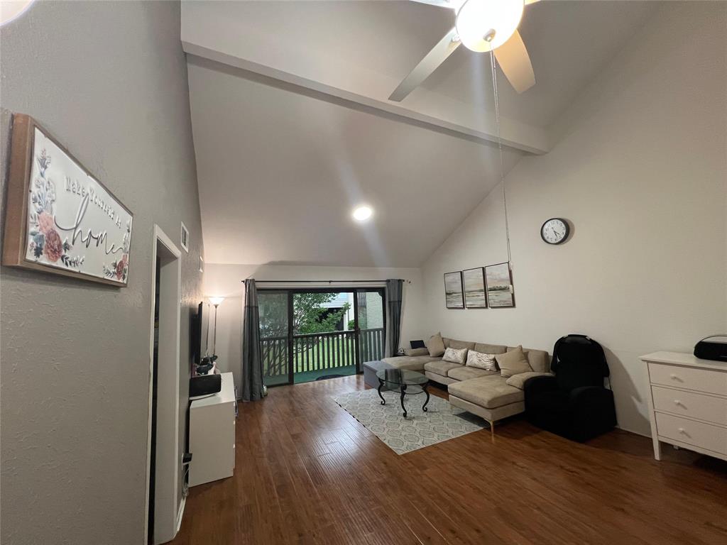 4569 North O'Connor Road, Unit 2318 Irving, TX 75062 - Photo 1 of 9 a living room with furniture and a wooden floor