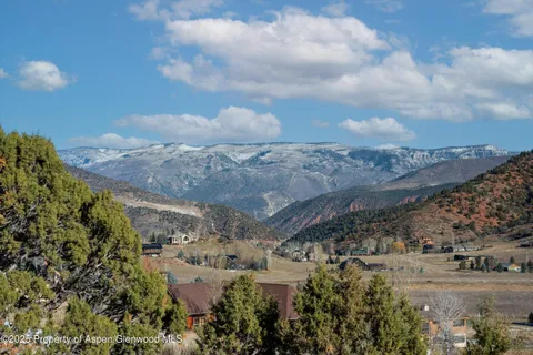a view of a mountain from a balcony