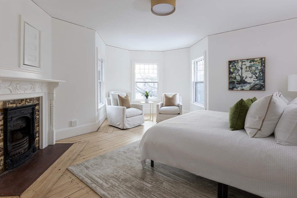 61 Toxteth Street Brookline, MA 02446 - Photo 12 of 21 a bedroom with bed and a fireplace