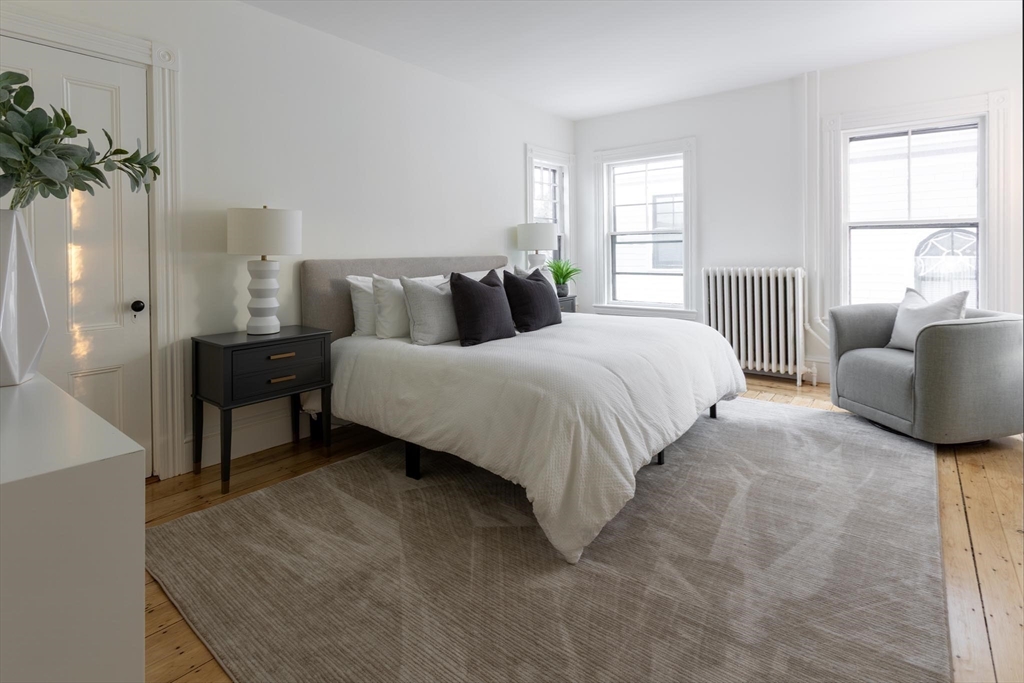 61 Toxteth Street Brookline, MA 02446 - Photo 13 of 21 a bedroom with a bed and a couch