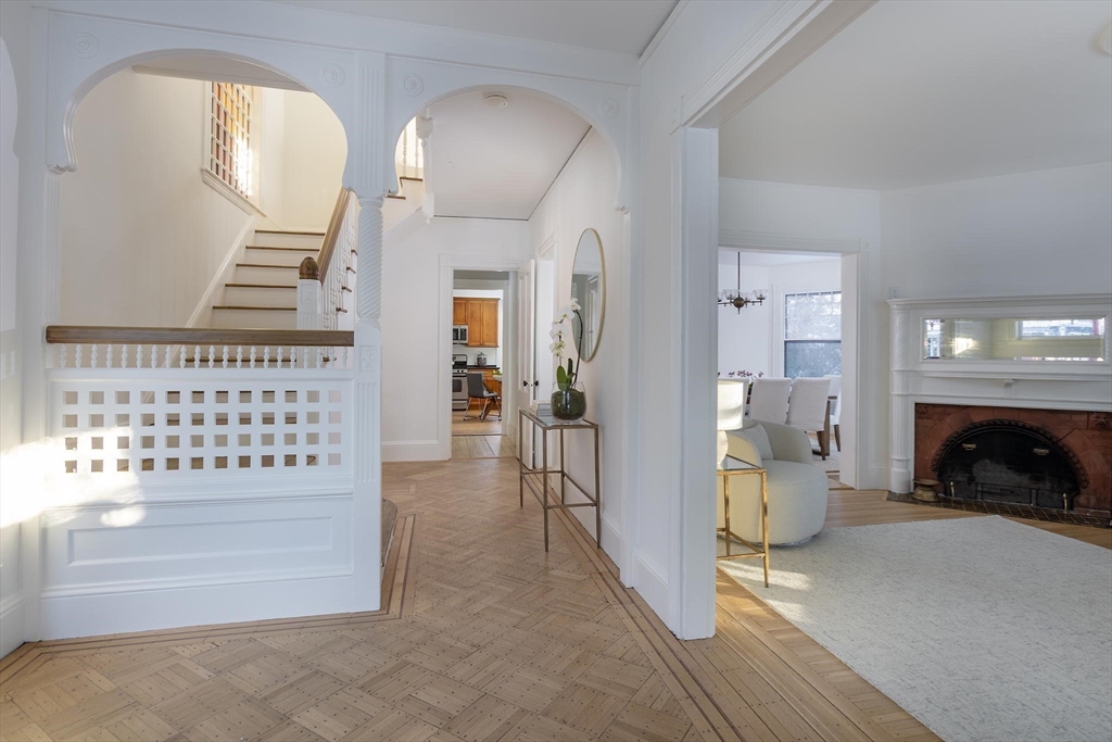61 Toxteth Street Brookline, MA 02446 - Photo 3 of 21 a view of a livingroom with furniture and a fireplace