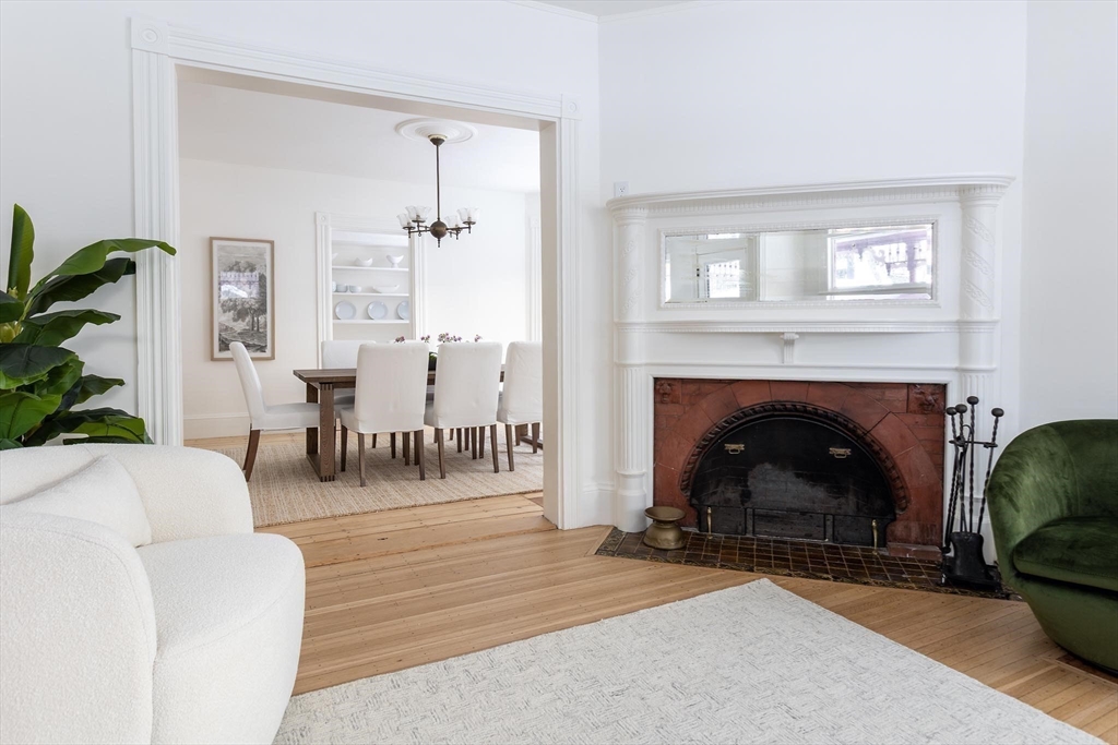 61 Toxteth Street Brookline, MA 02446 - Photo 7 of 21 a living room with furniture and a fireplace