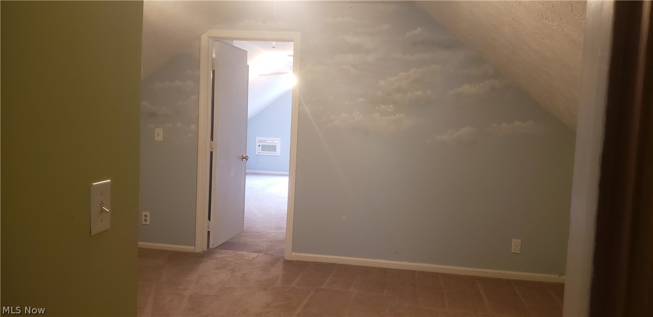 12765 Butternut Road Burton, OH 44021 - Photo 22 of 28 The walk thru room from the loft to the bonus room almost makes its own upstairs living suite.