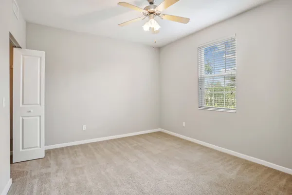 a view of an empty room with a window