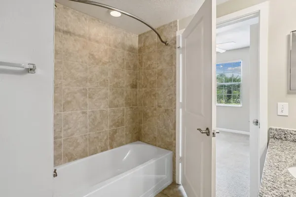 a bathroom with a bathtub and a shower