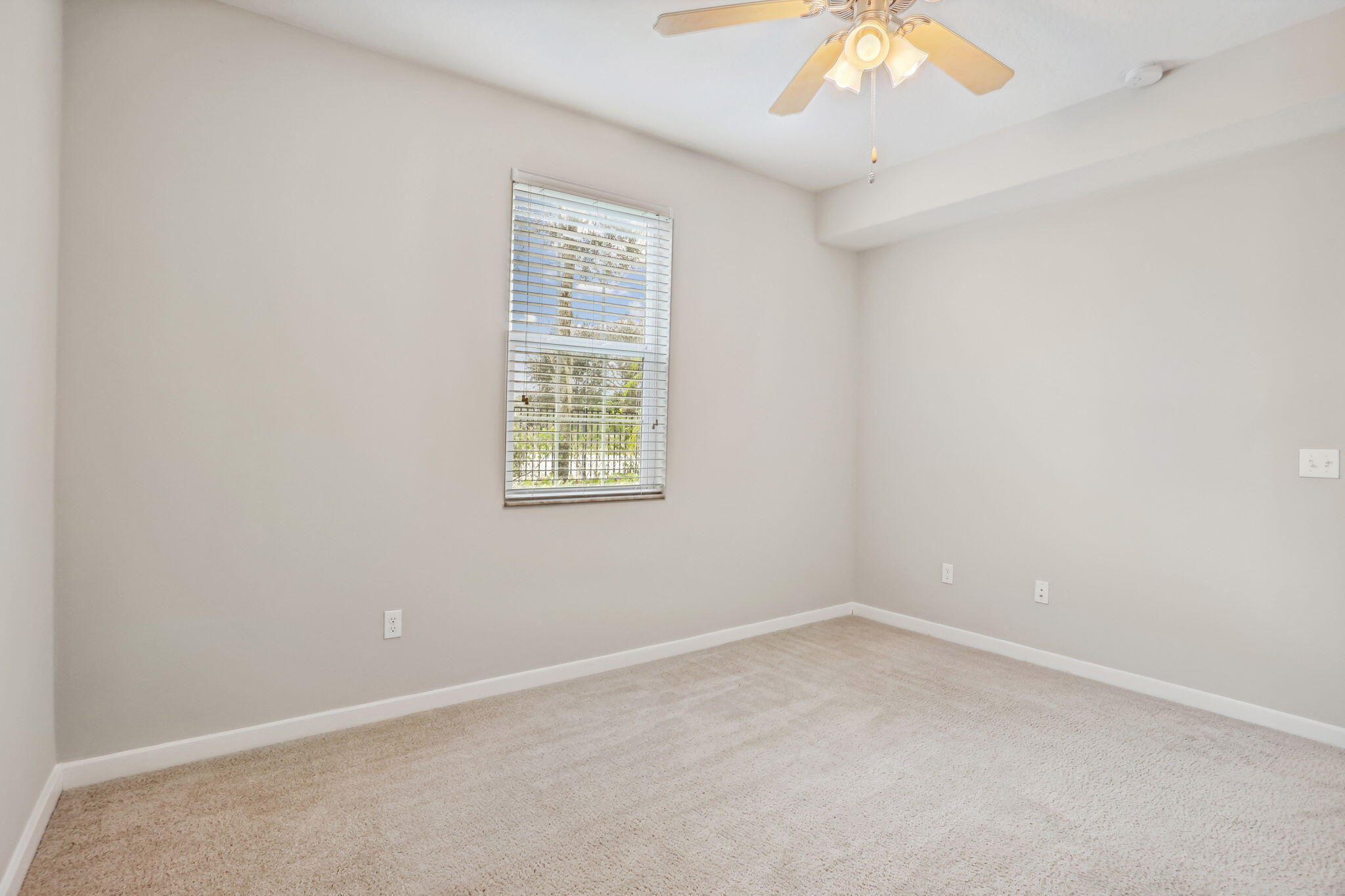 3613 High Ridge Road, Unit 304 Boynton Beach, FL 33426 - Photo 16 of 32 an empty room with a window