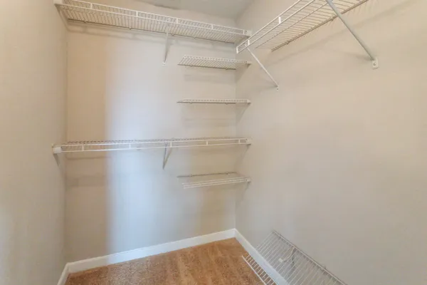 a view of an empty walk in closet