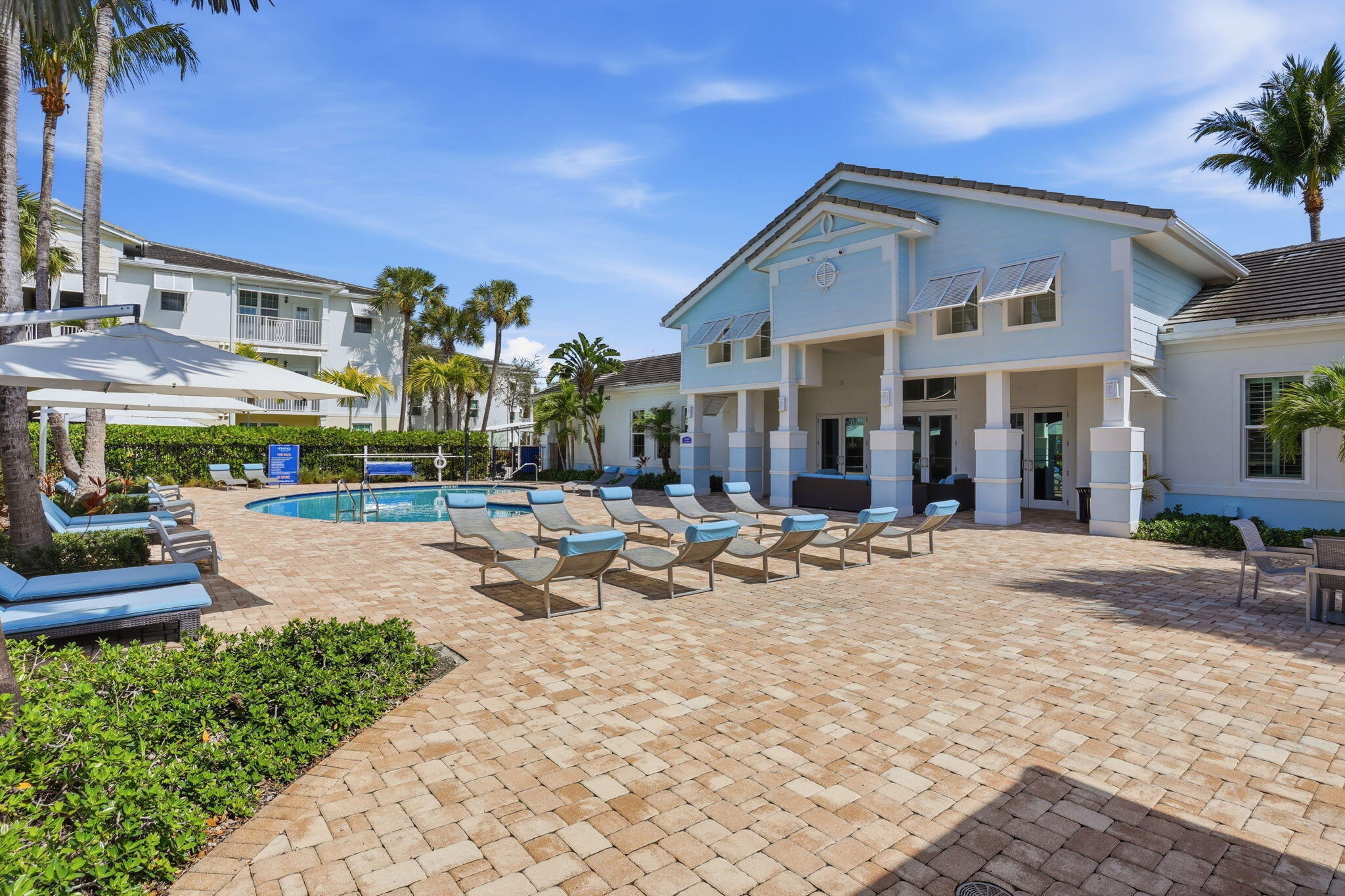 3613 High Ridge Road, Unit 304 Boynton Beach, FL 33426 - Photo 3 of 32 a front view of a building with sitting area